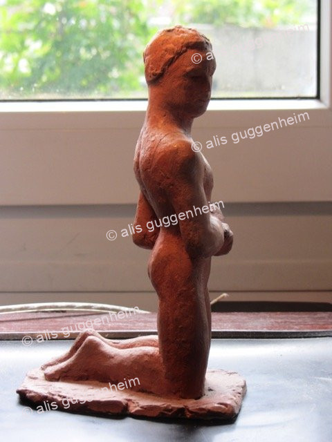 Kniende Figur